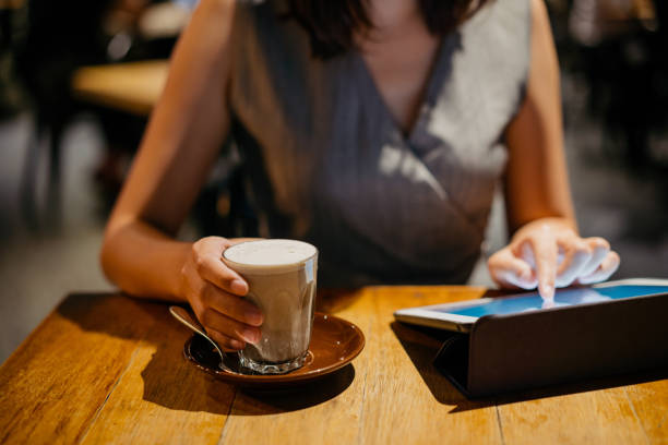 istock Young asian woman using digital tablet in cafe 1272438905