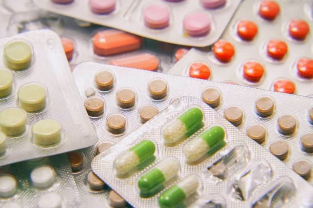 istock Tablets and capsules Packed in blisters. Pharmaceutical or medical background 1272440359