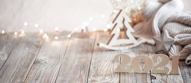 New year 2021 holiday background with new year decor New year 2021 holiday background with decor . Blurry lights in the background. The concept of the celebration. greeting card white decoration glitter stock pictures, royalty-free photos & images