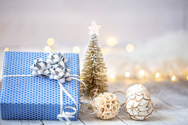 istock New year holiday background with a blue gift box. 1272442822