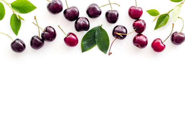 istock Layout of sweet cherries with leaves, top view, copy space 1272443239