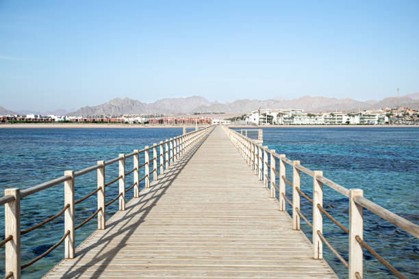 istock The background is a beautiful wooden long pier 1272444084