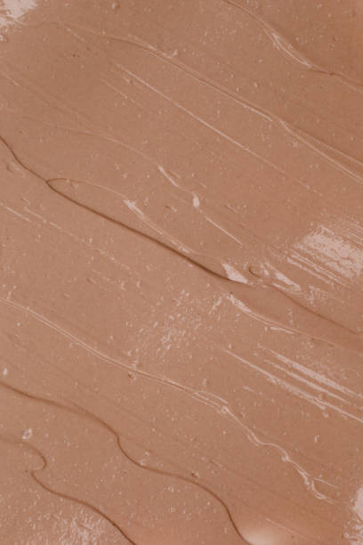 istock Natural beige cosmetic or make up textured background. 1272445355