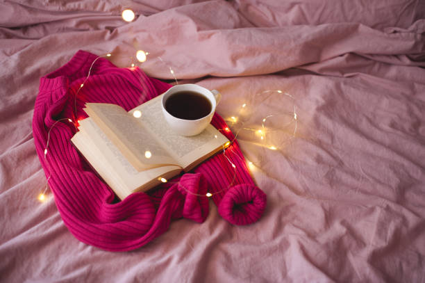 istock Cup of coffee with book 1272445717
