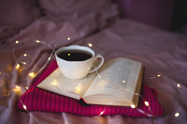istock Cup of coffee with book 1272445790