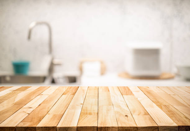 istock Wood table top on blur kitchen counter (room)background 1272447578