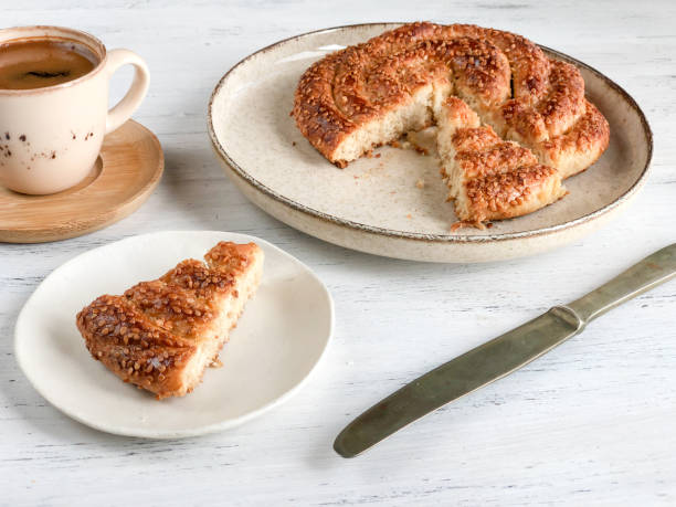 istock coffee and braided cookie with sesame on a wooden table 1272448527