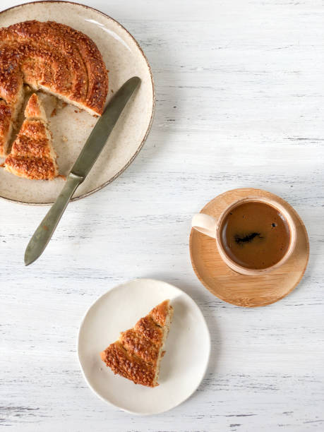 istock coffee and braided cookie with sesame on a wooden table 1272450187