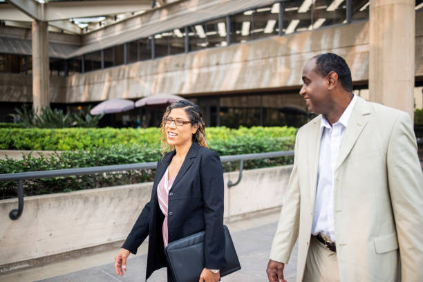 istock Coworkers Walking and Discussing Business 1272450264