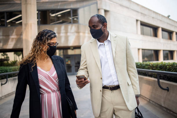istock Coworkers Walking and Discussing Business 1272450289