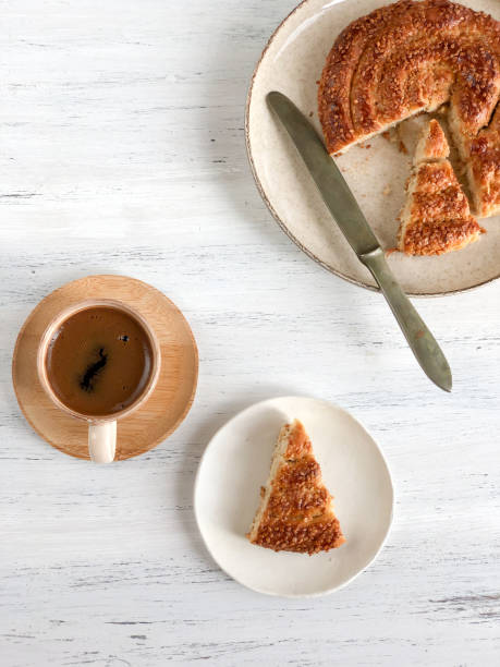 istock coffee and braided cookie with sesame on a wooden table 1272451156
