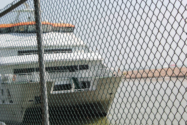 istock wire fence against a ship 1272454349
