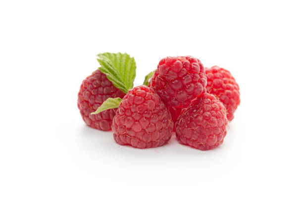 istock Ripe raspberries with leaf isolated on a white background 1272454720