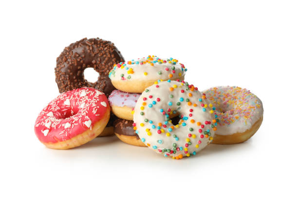 istock Tasty baked donuts isolated on white background 1272456458