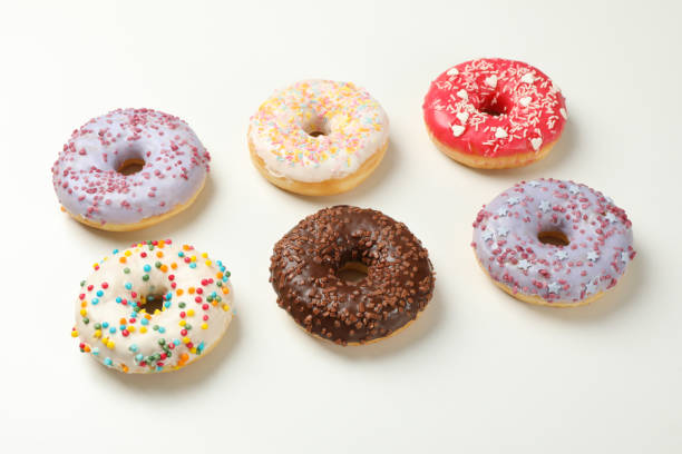 istock Flat lay with tasty donuts on white background 1272457126