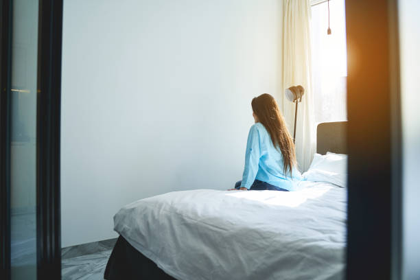 istock Female dressed in casual clothes looking at the wall 1272458503