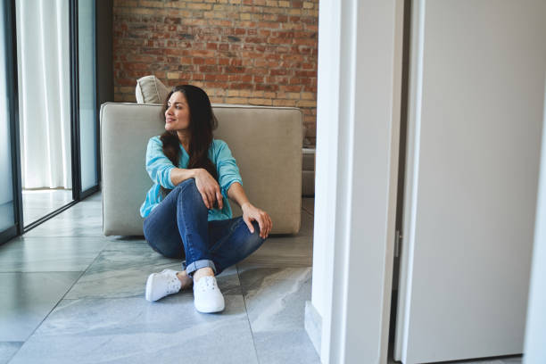 istock Dreamy lady with long dark hair looking away 1272458658