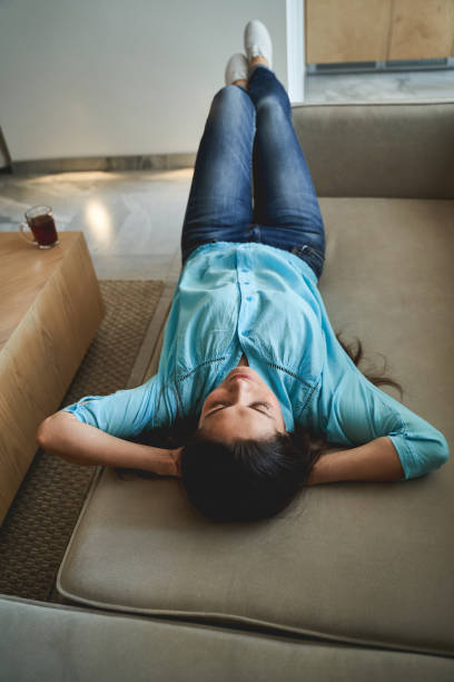 istock Dark-haired woman dozing off in broad daylight 1272458674