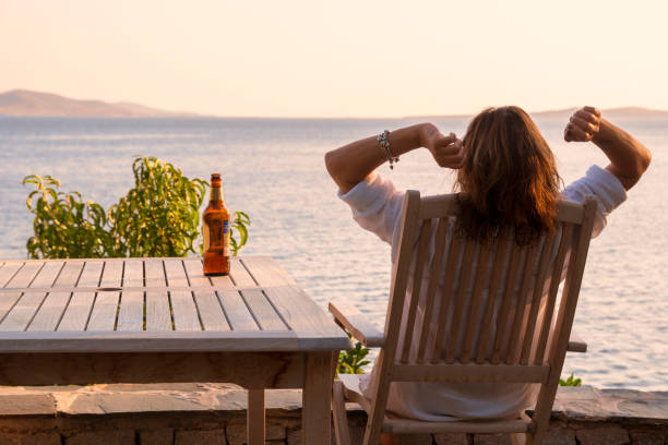 istock Cute woman drinking beer. 1272458799