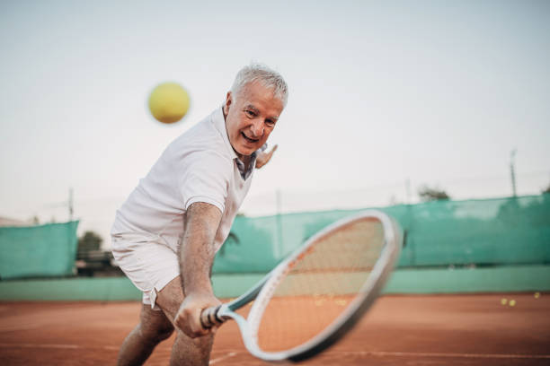 istock Active senior man playing tennis 1272458974