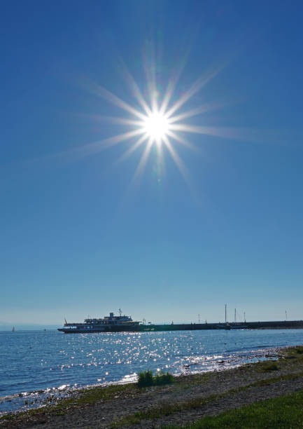 September 2020: Blue sky and sun rays above the beach at Langenargen on Lake Constance