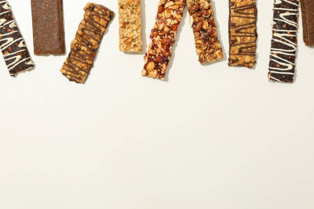 istock Tasty granola bars on white background, top view 1272460167