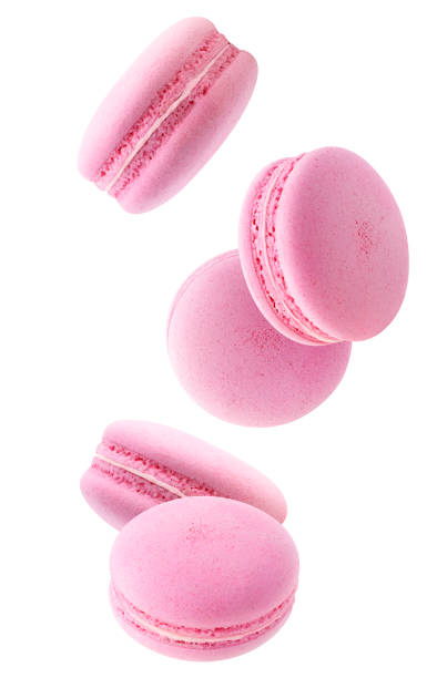istock Falling pink macaroons isolated in the air 1272460492
