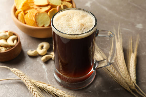 istock Beer, wheat and snacks on gray background, close up 1272462413