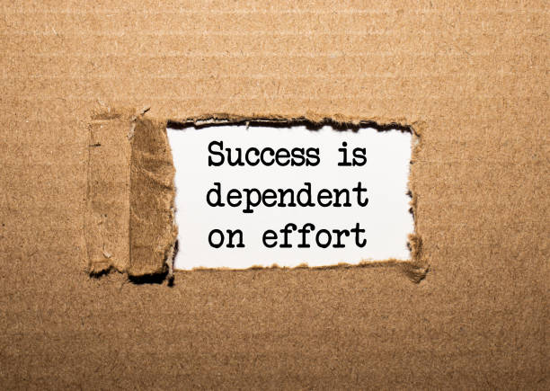 istock The text success is dependent on effort. behind torn brown paper 1272462441