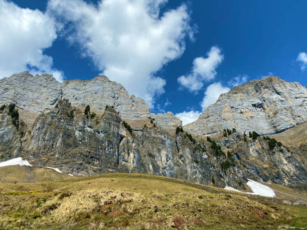 istock Alpine peaks Schibenstoll and Hinterrugg (Hinderrugg) in the Churfirsten mountain range, between the Obertoggenburg region and Lake Walensee - Canton of St. Gallen, Switzerland (Schweiz) 1272462902