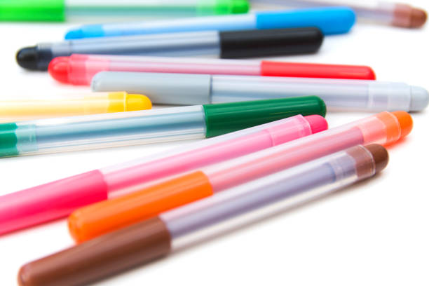 istock Colorful markers scattered on a white background. Art and education. 1272464011