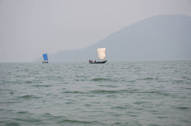rambha odisha india on december 27th 2016: two sail boat floating over chilika lake at rambha odisha india