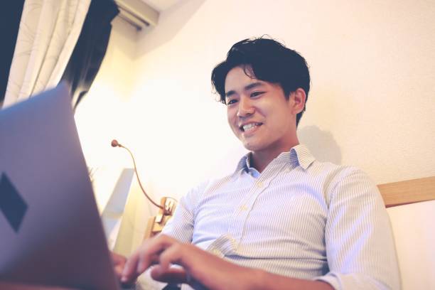 istock Young Asian businessman working at home 1272465365
