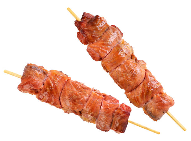istock Shish kebab of salmon fish on a white background. Isolated 1272468097
