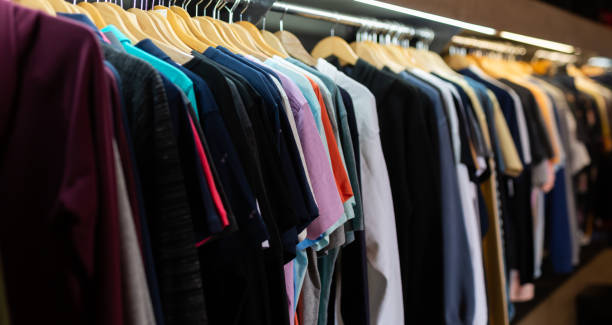 istock Stand with various clothes in clothing boutique 1272472464
