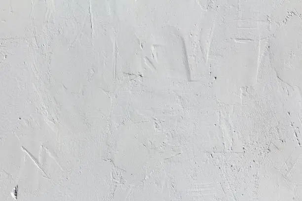 White uneven plastered concrete wall texture