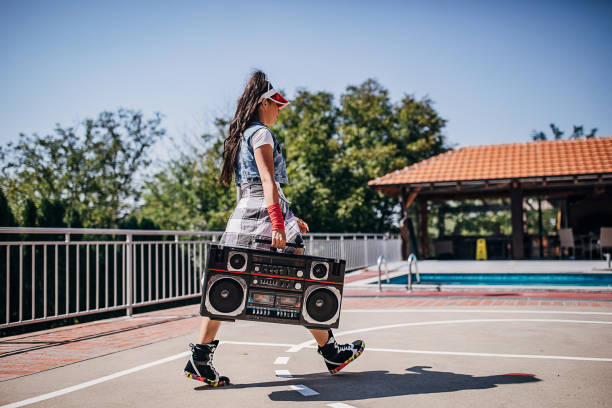 istock One attractive young female dancer walking with tape recored 1272478843