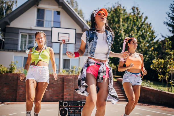 istock Modern female dancers dancing outdoors on a sunny summer day 1272479916
