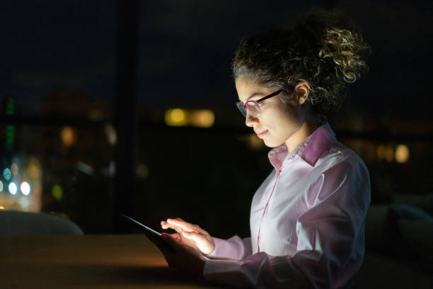 istock Business woman working late online using a digital tablet 1272482188