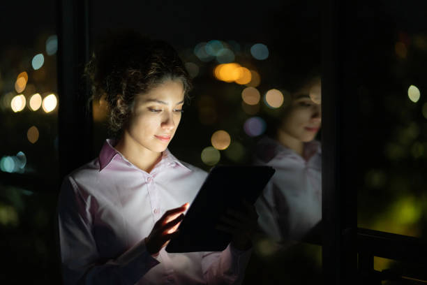 istock Business woman working late online using a tablet computer 1272482191