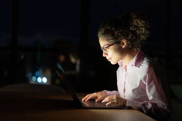 istock Business woman working late online using a laptop computer 1272482197