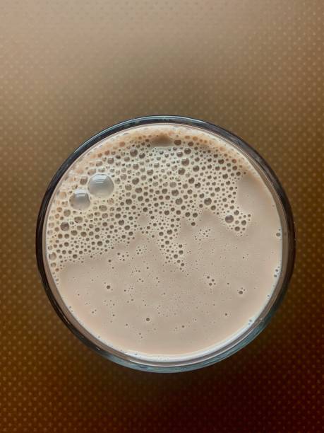 istock Glass of Chocolate Milk with Bubbles 1272482461