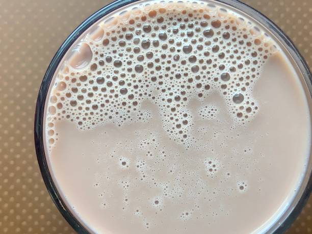 istock Glass of Chocolate Milk with Bubbles 1272482462