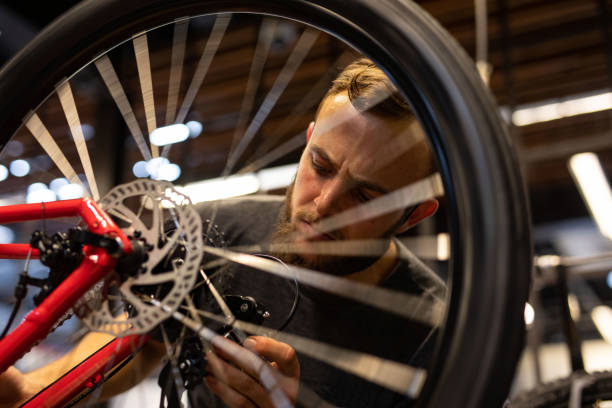 istock A bike mechanic in his workshop. 1272482478