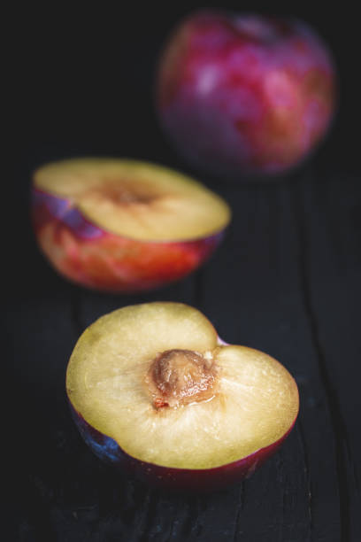 Purple plum on black
