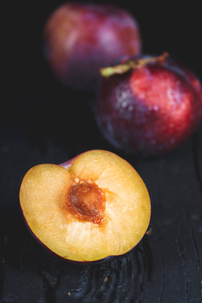 Purple plum on black