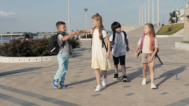 istock Four Friends Are Going to School 1272483976
