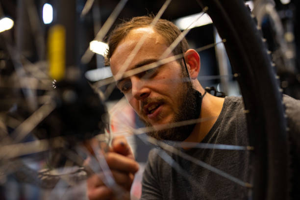 istock A bike mechanic in his workshop. 1272484985