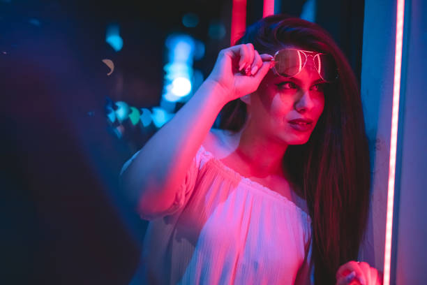 istock Woman and neon light 1272485036