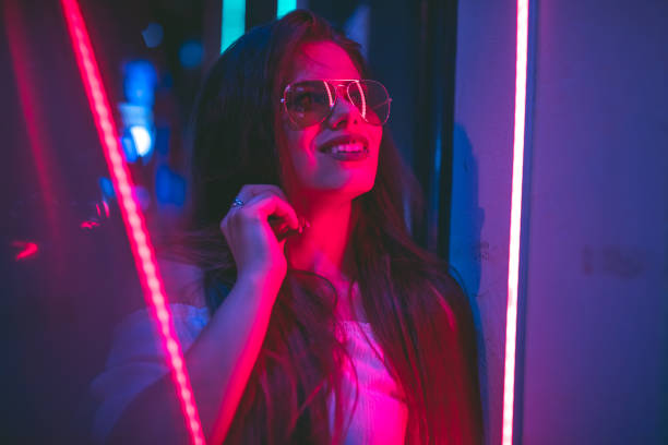 istock Woman and neon light 1272485175